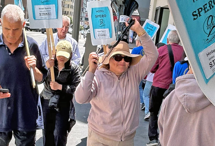 Members of UNITE HERE Local 2 picket outside Hotel Spero in San Francisco Aug. 16, part of five-day strike for wage increases and to protest bosses slashing their paid days off.