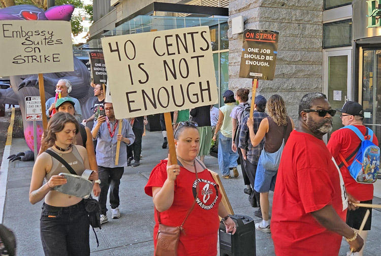 Over 100 unionists joined UNITE HERE Local 8 striking hotel workers in front of Embassy Suites in Seattle Aug. 20. Workers rejected bosses’ offer of paltry 40 cents wage increase.