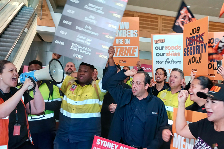 Members of Transport Workers Union rally at Qantas airline terminal in Sydney, Australia, Sept. 24. One-day strike by freight workers demanded raises, jobs, safe working conditions.