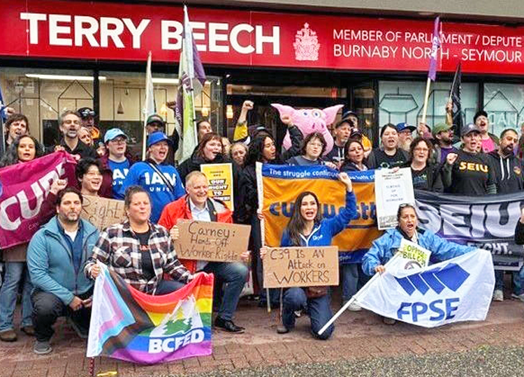 Members of the Canadian Union of Public Employees and other unions rally in Burnaby, British Columbia, Sept. 25 against Bill C-39, which would give the government power to end strikes.