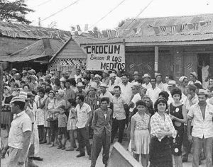 Cubans in Cacocum gather to greet first revolution-trained doctors and dentists in 1965. Graduates were accompanied by Fidel Castro, central leader of Cuba’s socialist revolution.